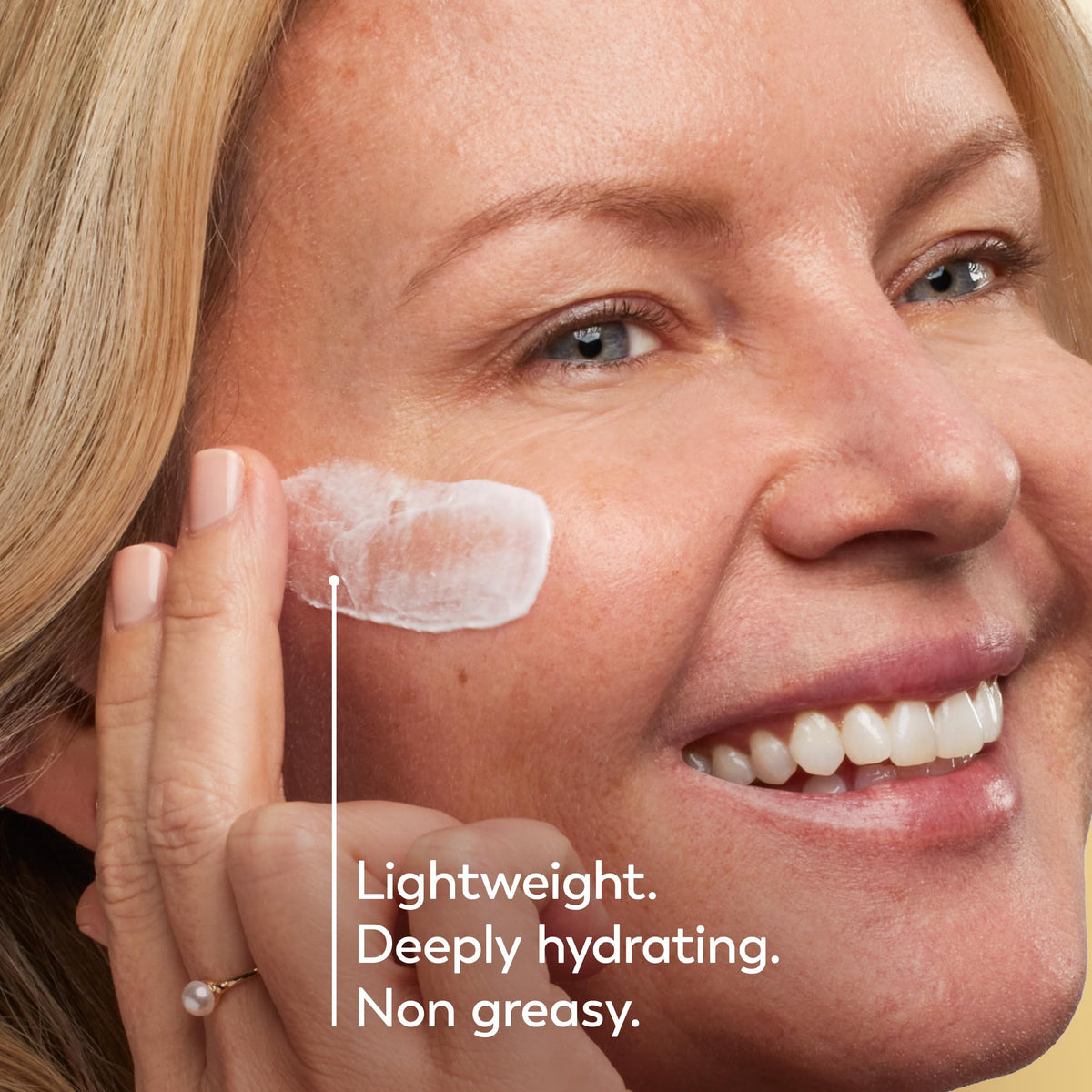 Olay moisturizer spread on forehead showing hydration and smoothing