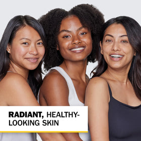 Olay Complete bottle on bathroom vanity in lifestyle scene, promoting daily routine benefit