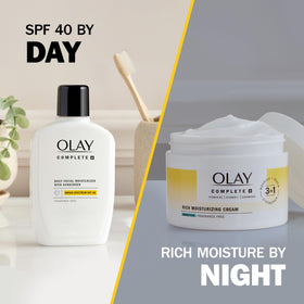 Olay jar next to hand illustrating 8.5 oz size and real-life scale