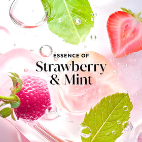 Strawberry and mint elements beside Olay bottle illustrating scent notes