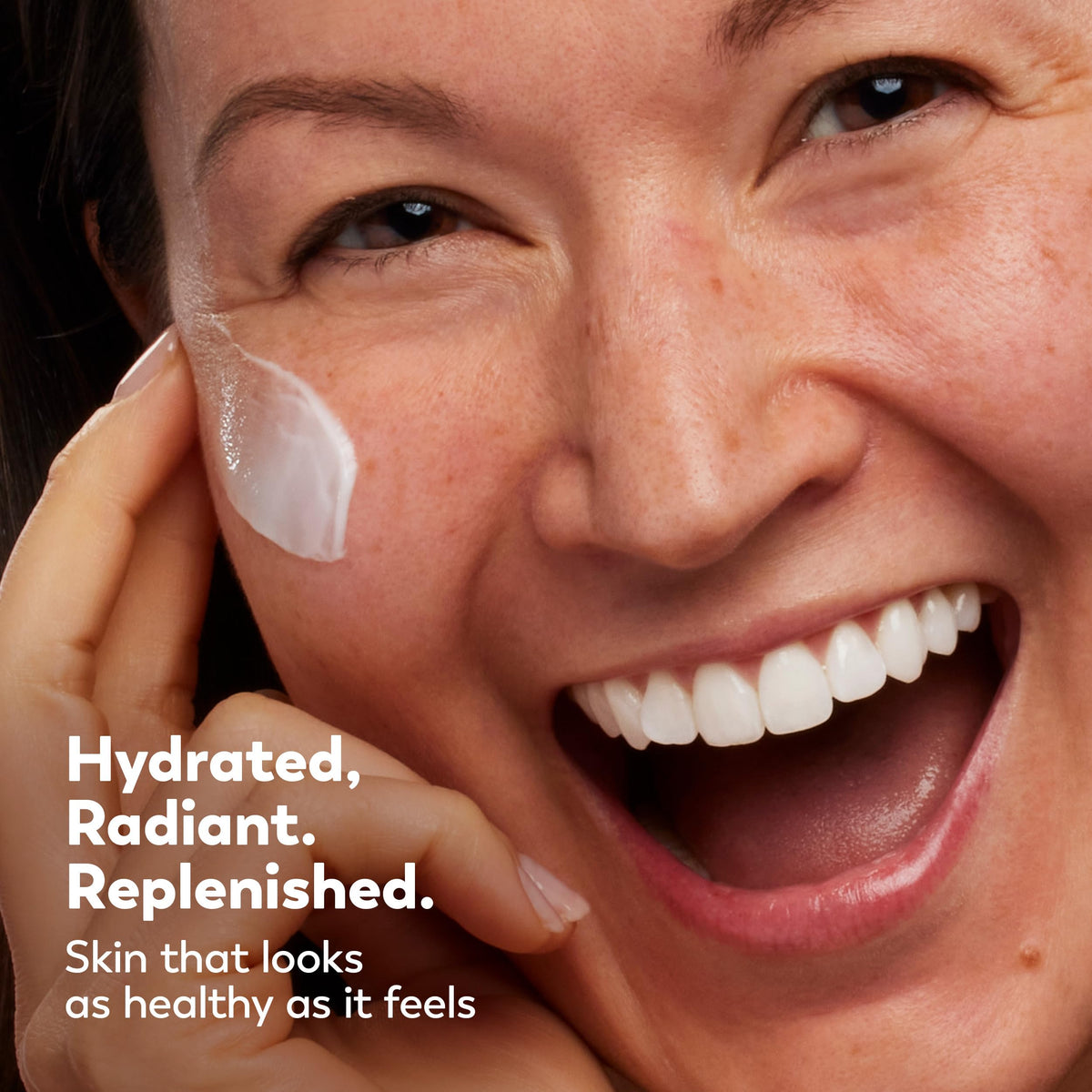 Olay hand application showing moisturized skin and immediate softness benefit
