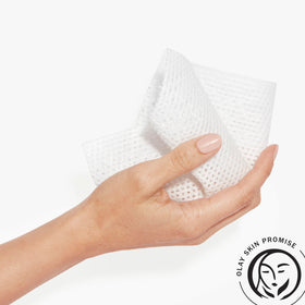 Olay in use wiping face demonstrating quick, no-rinse refresh