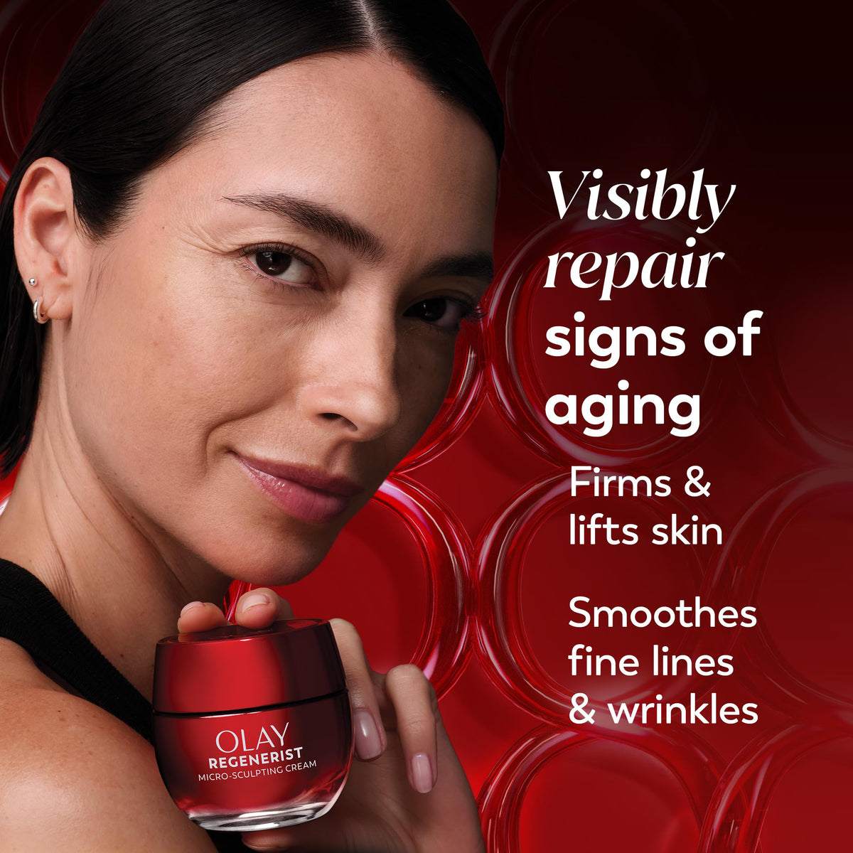Olay cream being dabbed on hand demonstrating fast absorption and plump skin