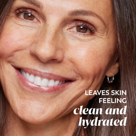 Olay 5 oz bottle beside common items to show size and travel-friendly benefit