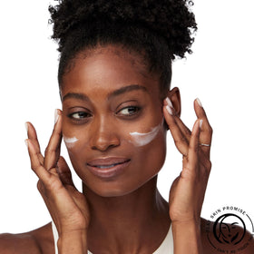 Applying Olay moisturizer to face and neck for smooth, non-greasy finish