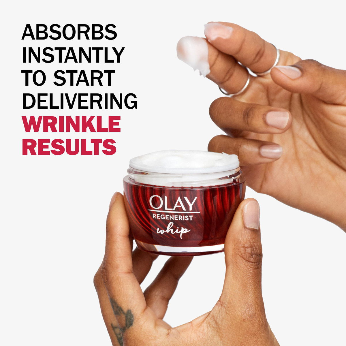 Olay opened jar from above revealing whipped cream texture, highlights lightweight feel