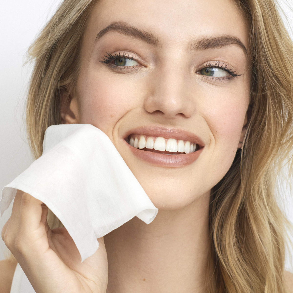 Olay wipe removing waterproof mascara to show effective eye makeup removal