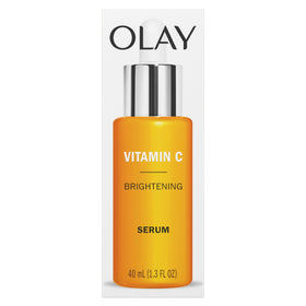 Olay serum surrounded by citrus props indicating fresh scent and brightening