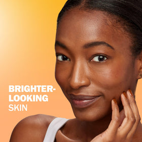Olay bottle in hand showing 40 mL scale and portable size benefit