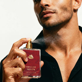 Old Spice atomizer spraying Midnight Moon showing fine mist application benefit
