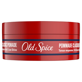 Old Spice pomade on barber counter in barbershop scene, conveying professional results benefit