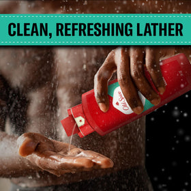 Old Spice bottle held in hand to show 24 oz size advantage