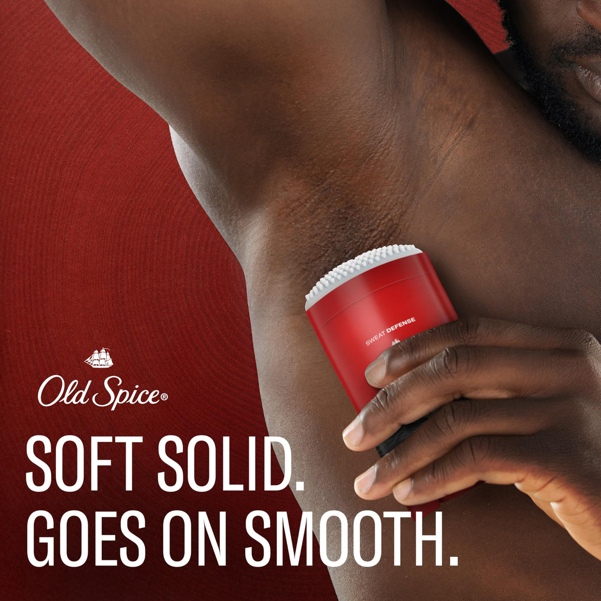 Old Spice stick being applied underarm for quick coverage
