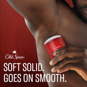 Old Spice stick being applied underarm for quick coverage