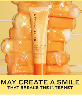 Ole Henriksen lip application lifestyle shot showing glimmer and plumping benefit