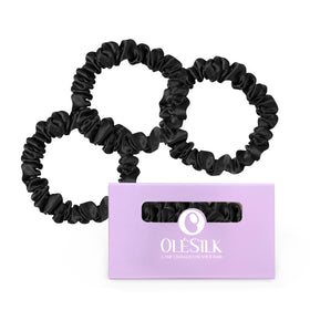 OLESILK front view of three black silk scrunchies showing sleek packaging and neat presentation