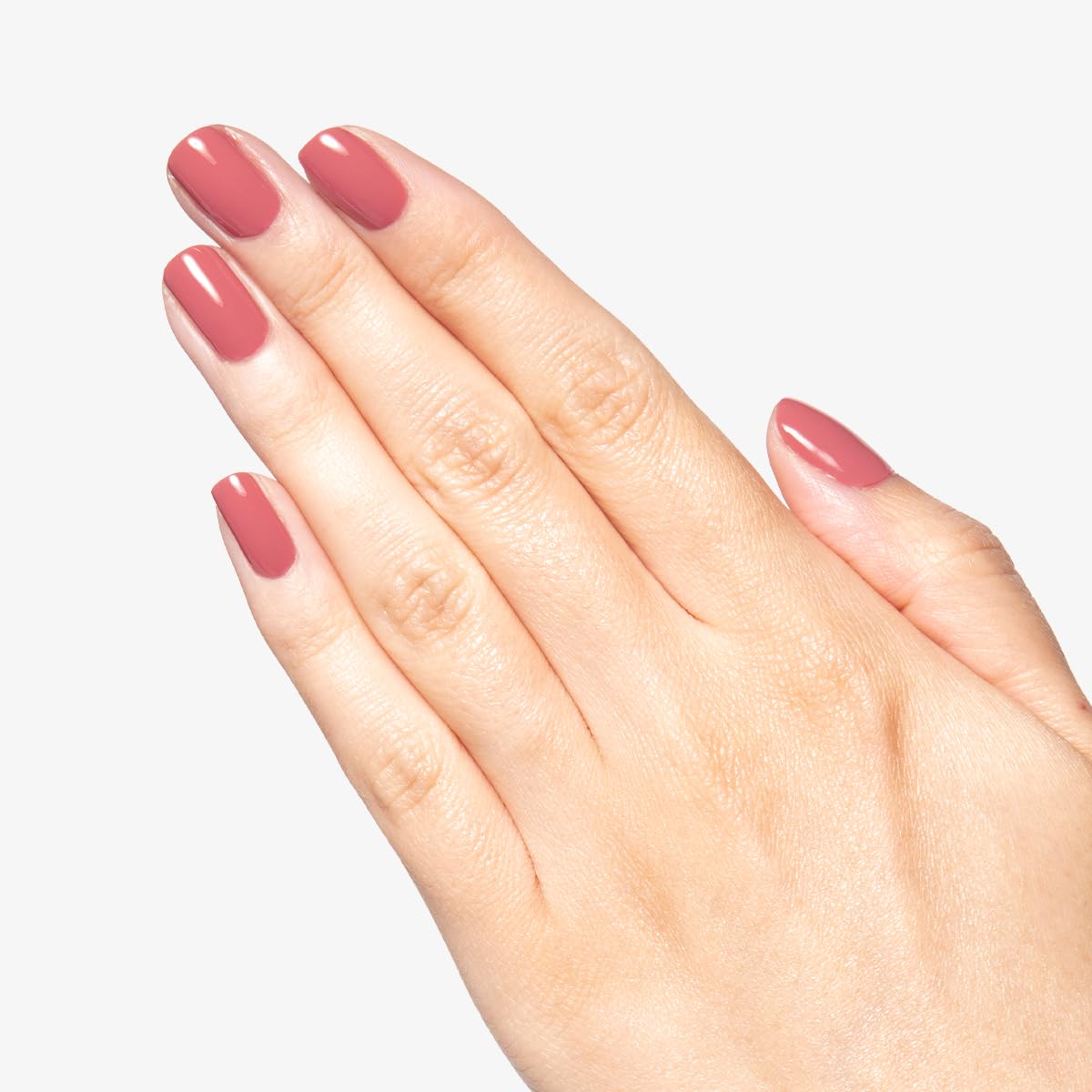 Manicure using Olive & June Boysenberry Glass showing salon-quality wear