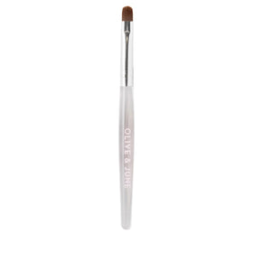 Olive & June front view of cleanup brush showing sleek shape and professional finish