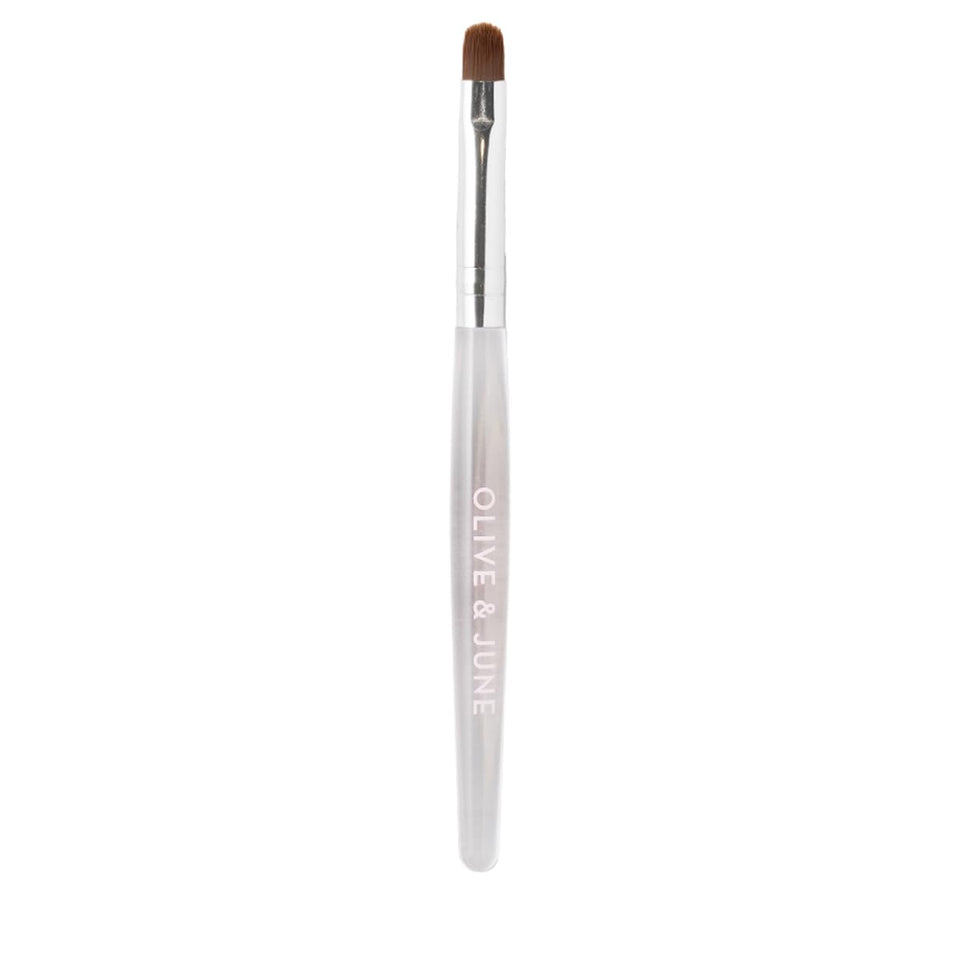 Olive & June front view of cleanup brush showing sleek shape and professional finish