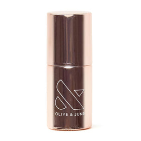 Olive & June front bottle view showing clean primer packaging and benefits