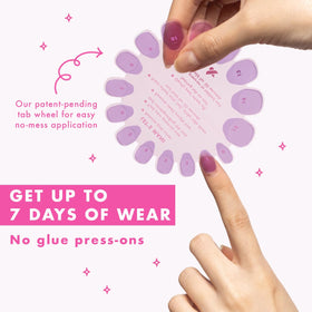 Olive & June press-on being applied to a natural nail highlighting fast, secure attachment