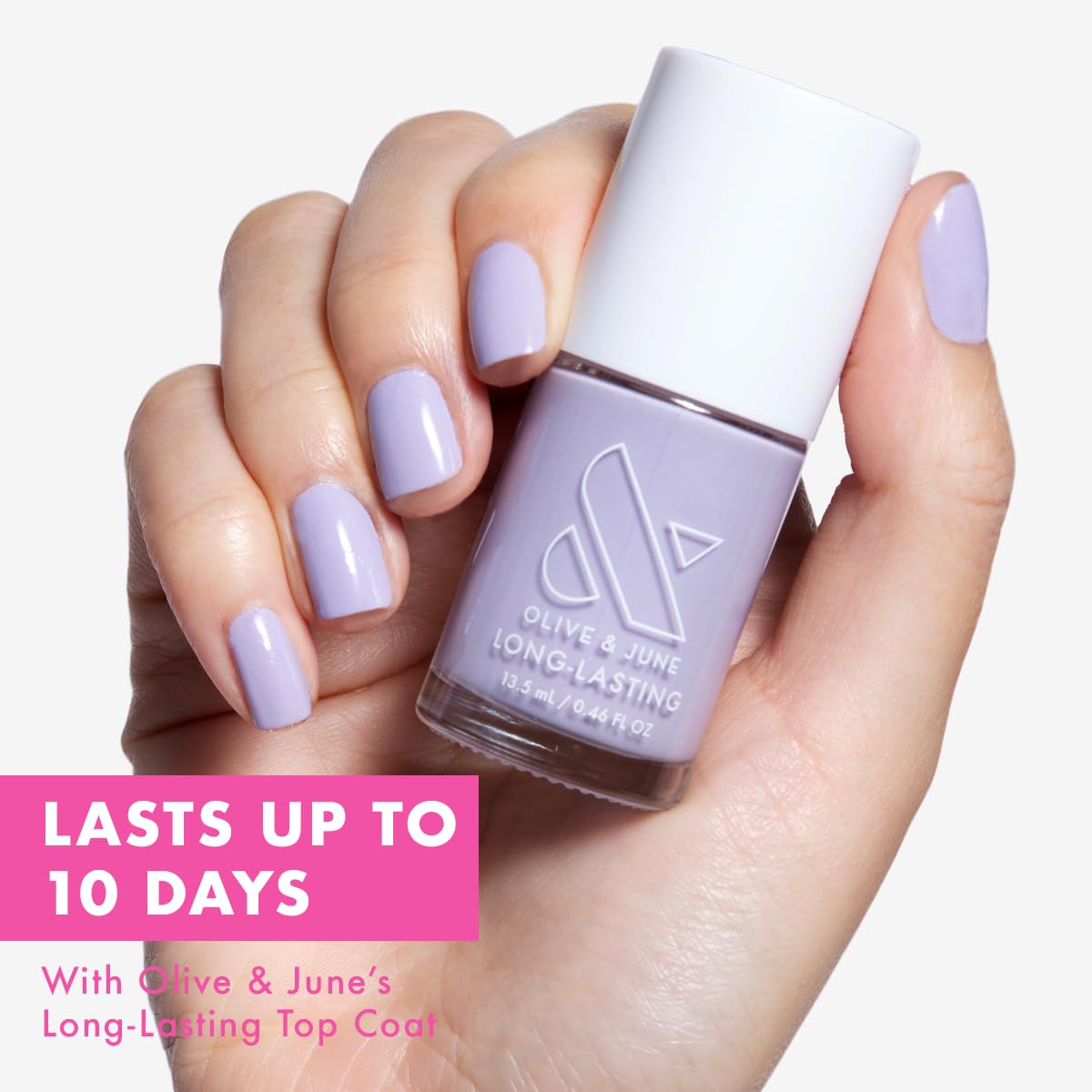 Olive & June wide fan brush spreading polish evenly for quick, streak-free application