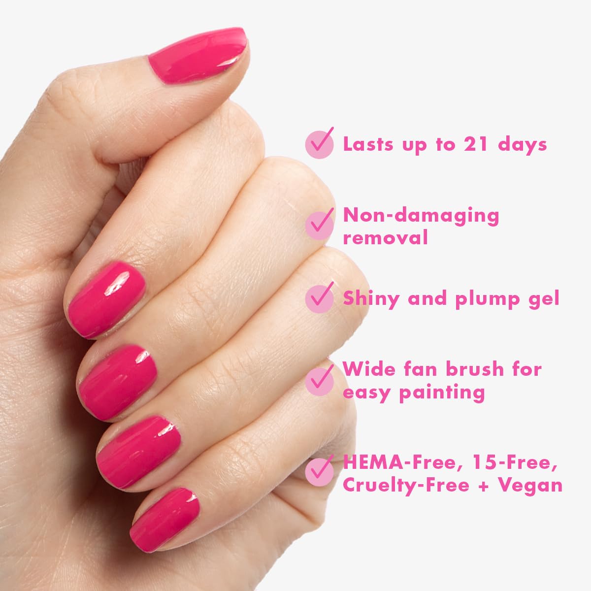 Hand with XOXO Hot Pink manicure by Olive & June showing salon-quality shine