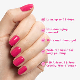 Hand with XOXO Hot Pink manicure by Olive & June showing salon-quality shine