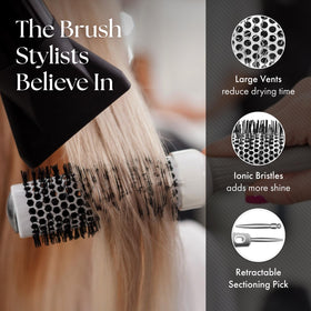 Olivia Garden brush held in hand to show scale, comfortable ergonomic grip benefit