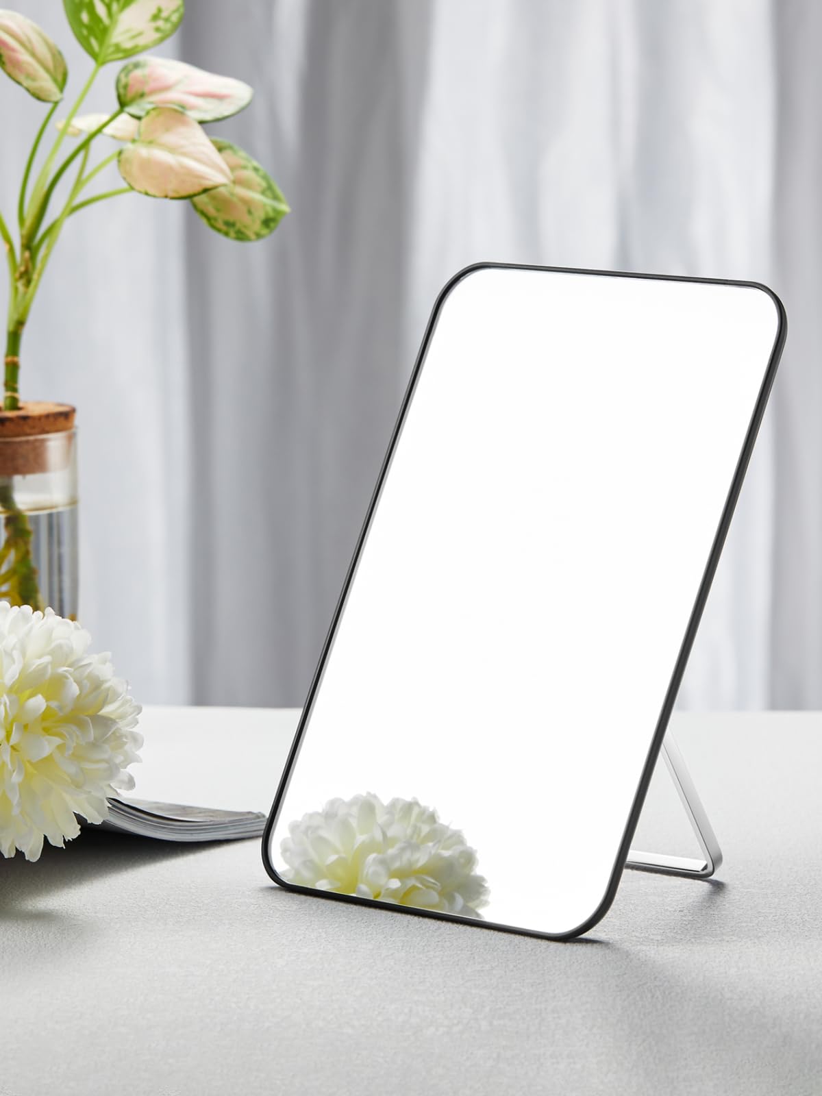 OMIRO close-up of mirror surface highlighting smooth, distortion-free glass