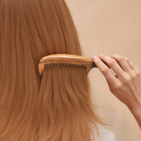 Onedor comb used on styled hair demonstrating smoothing and anti-static benefit