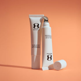 oneskin lip spf ingredients label highlighting zinc oxide and peptide benefits