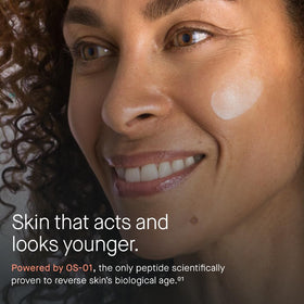 OneSkin FACE texture swipe on fingertip showing lightweight cream for fast absorption