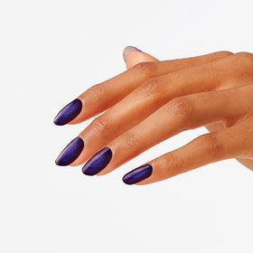 OPI painted nails on hand showing wearable dark purple manicure