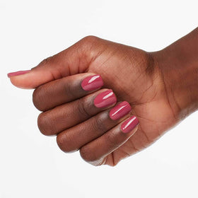 OPI nail application close-up showing pro-wide brush delivering streak-free finish