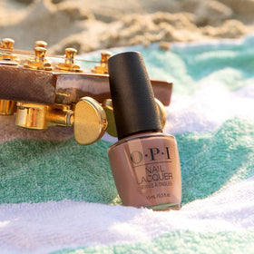 OPI bottle beside a coin to show size and travel-friendly convenience