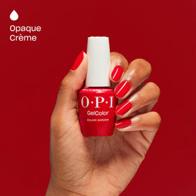OPI Cajun Shrimp pedicure on toes illustrating bold coral-red color
