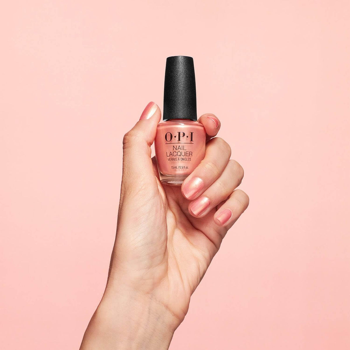 OPI painted nails with Data Peach swatch demonstrating pearly sheen and wearable color