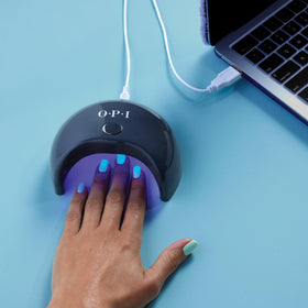 At-home manicure scene with OPI GELement base coat showing DIY salon-quality setup