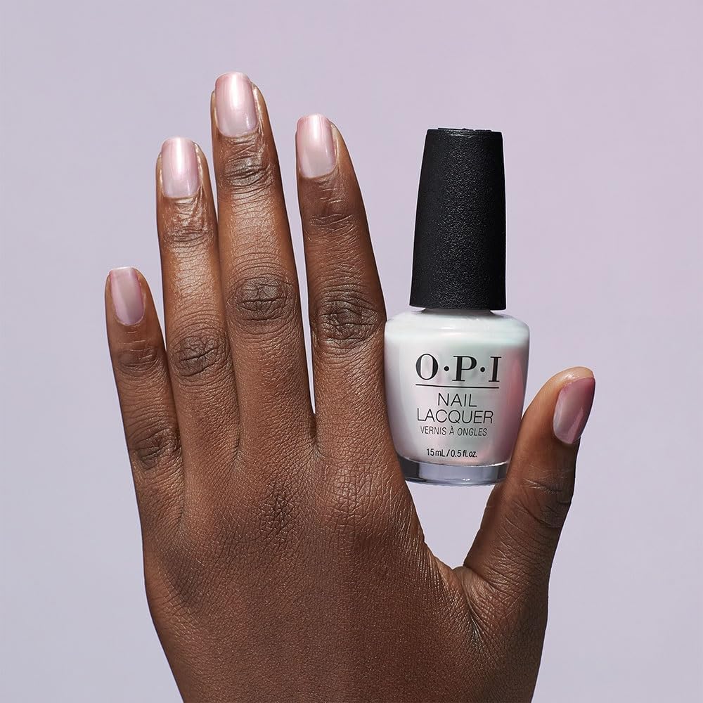 OPI layered over red polish illustrating color-softening and shimmer