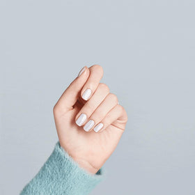 OPI bottle held in hand to show size and easy application control