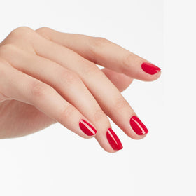 OPI Madam President being applied to nails illustrating smooth, chip-resistant coverage