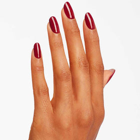 OPI Malaga Wine applied on nails in lifestyle setting for elegant look
