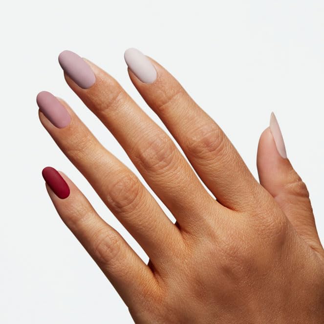 OPI top coat being applied to nails for chip resistance benefit