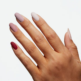 OPI top coat being applied to nails for chip resistance benefit