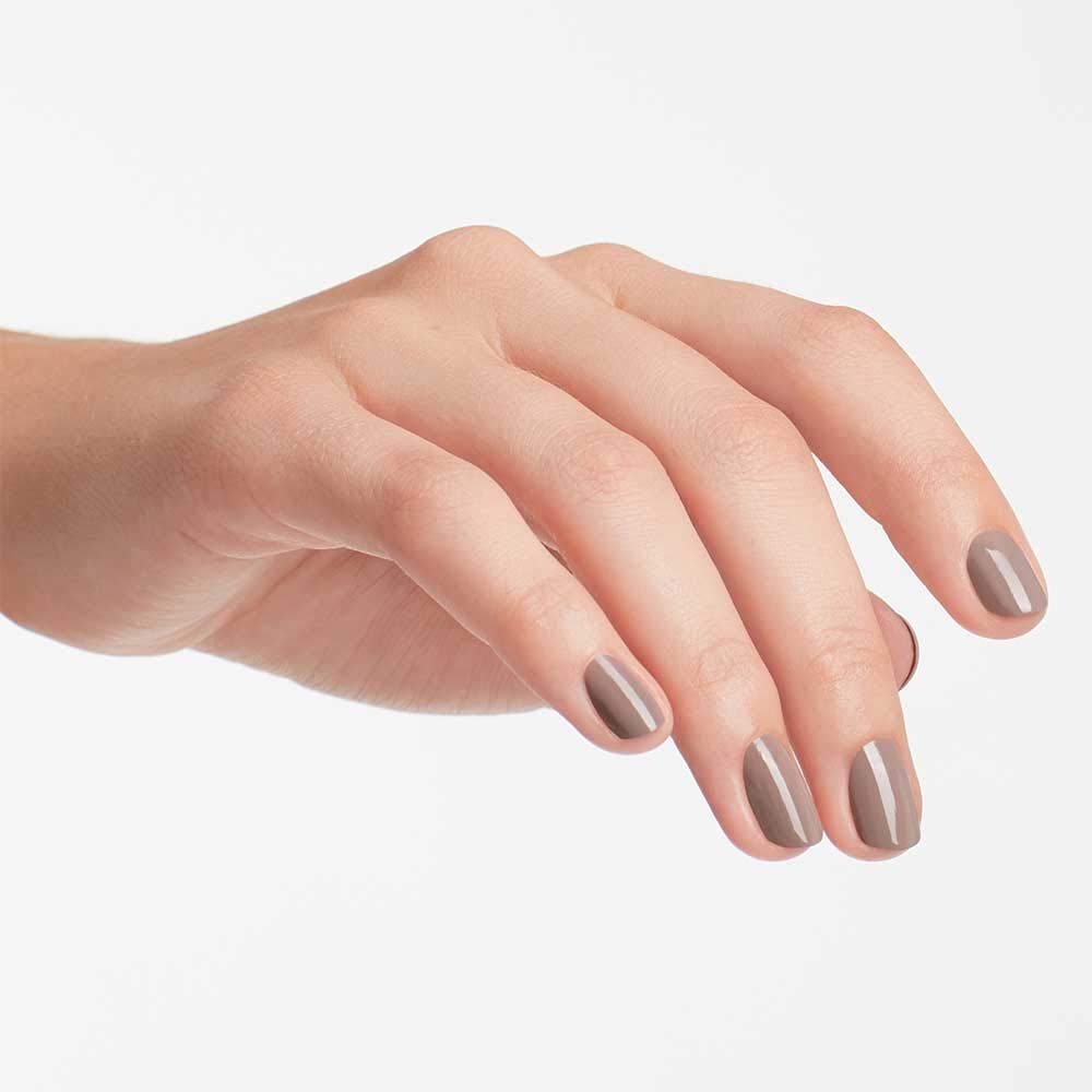 OPI painted nails on hand in lifestyle setting showing wearable sophistication benefit