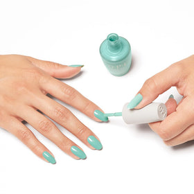 OPI Nature Strong application on model hands showing long-lasting, even finish