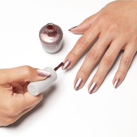 Styled pedicure scene with OPI rose gold creating polished, natural look