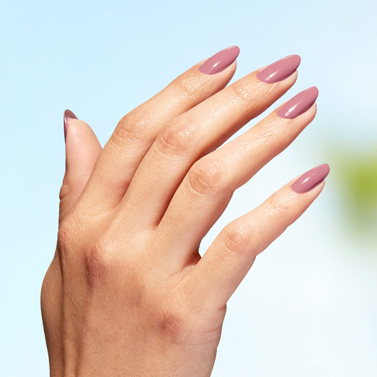 OPI model hands with polished nails showing professional, natural look benefit