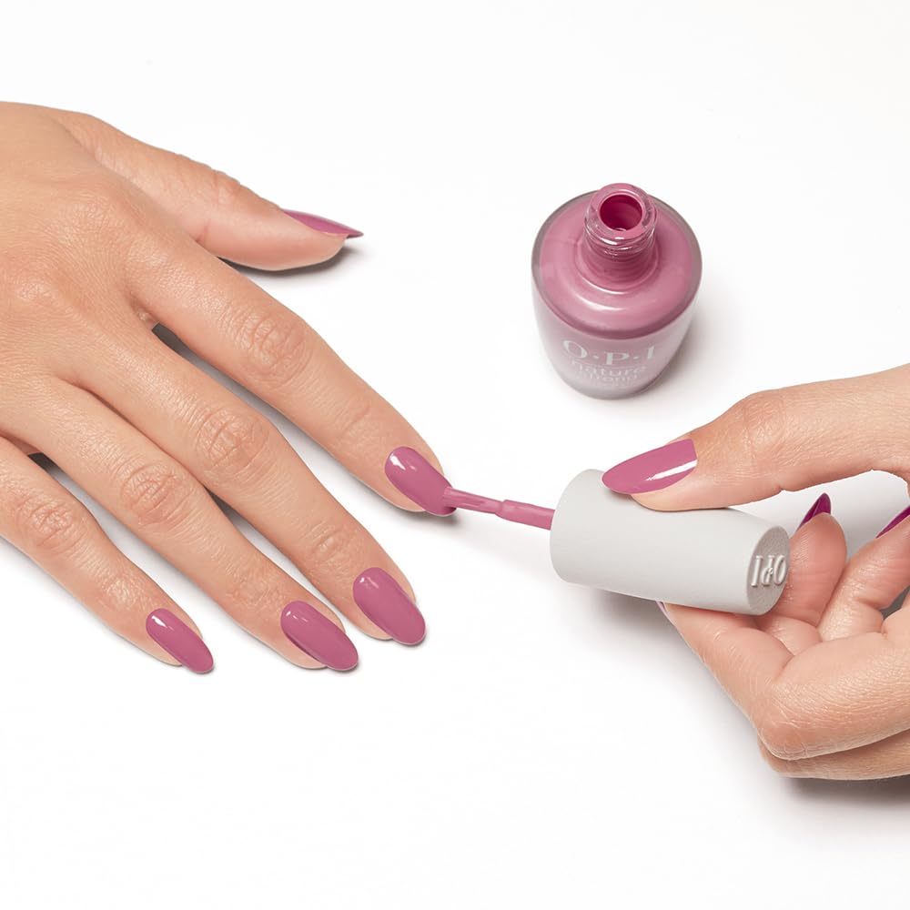 OPI bottle next to a hand for size comparison and easy-application benefit
